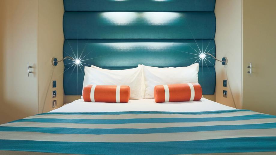 A bed in a RNLI College hotel room